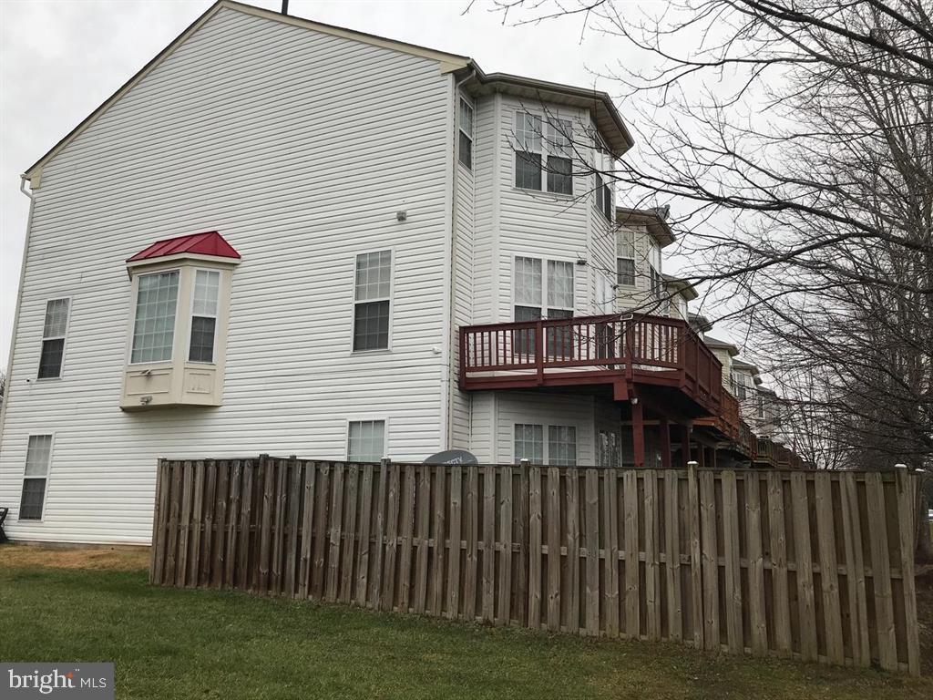 4244 La Mauricie Loop Dumfries, VA 22025 - Photo 4 of 16 a view of house with a yard