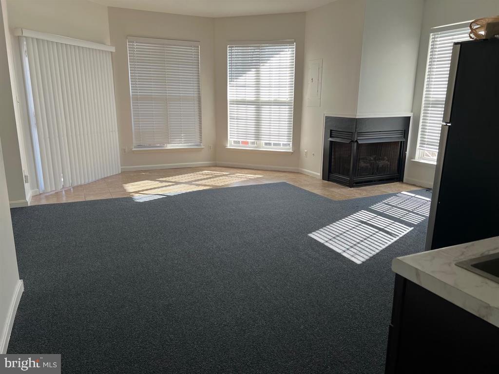 4244 La Mauricie Loop Dumfries, VA 22025 - Photo 7 of 16 an empty room with windows