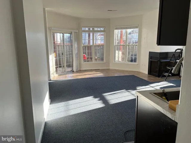 a view of livingroom with furniture and windows