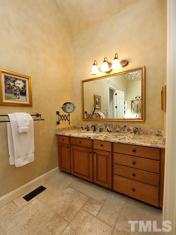 4417 Harbourgate Drive Raleigh, NC 27612 - Photo 14 of 25 One of the vanities...You can see the vaulted ceiling in here.