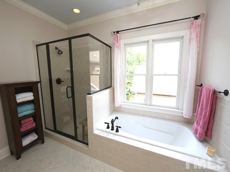 4417 Harbourgate Drive Raleigh, NC 27612 - Photo 16 of 25 This bath has a garden tub and separate shower.
