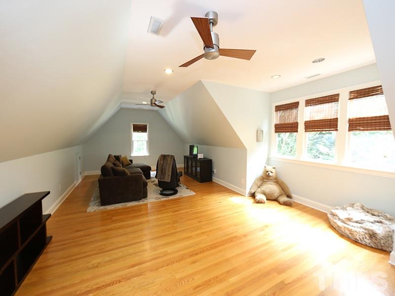4417 Harbourgate Drive Raleigh, NC 27612 - Photo 21 of 25 The bonus room offers space for sitting/tv watching and also games-whether it be pool or ping pong. There are 2 ceiling fans.