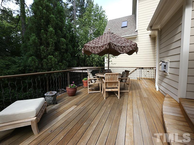 4417 Harbourgate Drive Raleigh, NC 27612 - Photo 22 of 25 The deck was rebuilt in 2007 with exotic Mangaris decking and rail with curved iron pickets. There are 2 levels to the deck-great for entertaining. A gate near the steps can keep kids or pets on the deck.