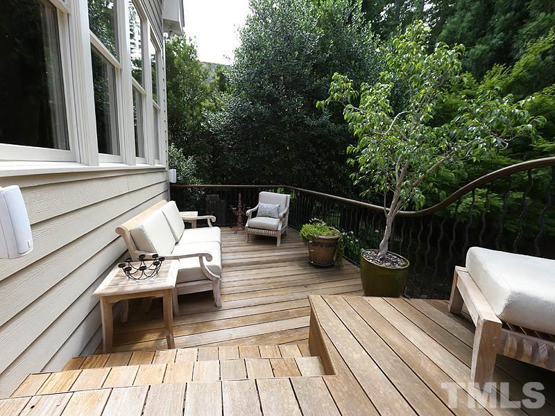 4417 Harbourgate Drive Raleigh, NC 27612 - Photo 23 of 25 You can see the levels of the deck overlooking a landscaped, fenced backyard. There is a natural gas line for grill on deck.