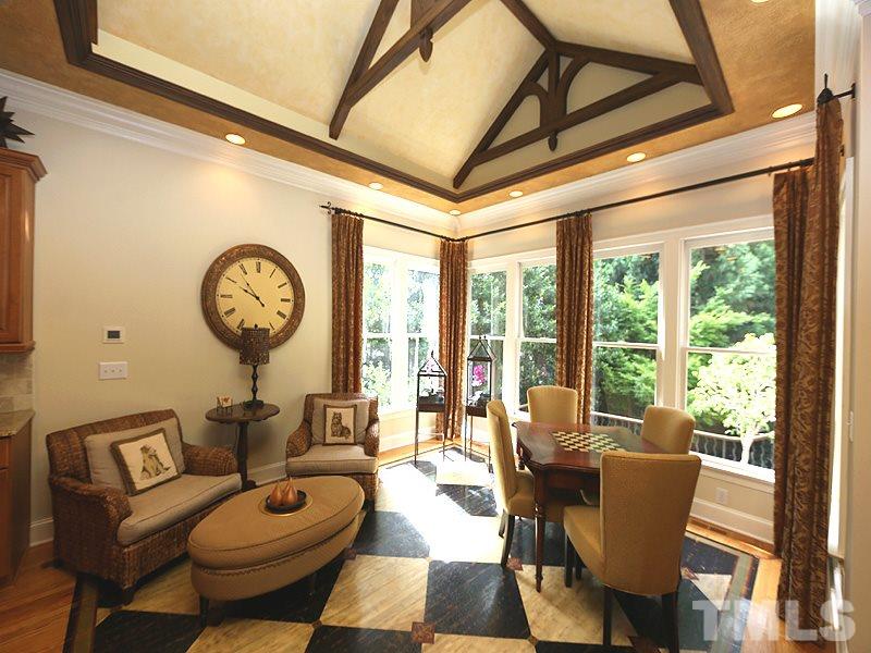 4417 Harbourgate Drive Raleigh, NC 27612 - Photo 10 of 25 The breakfast room has a vaulted tray with indirect lighting. Architectural beams create a dramatic effect. The area is quite large & is also used as a sitting area. Lots of natural light in addition to the recessed lights.