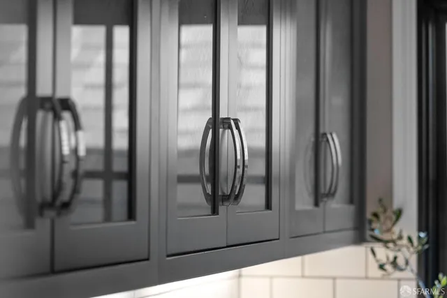 a bathroom with a glass shower door and a mirror