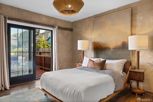 a bedroom with a bed and a lamp