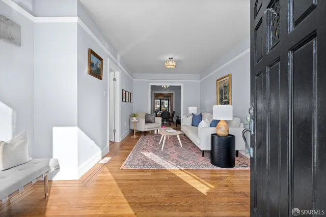 a view of a livingroom with furniture and window