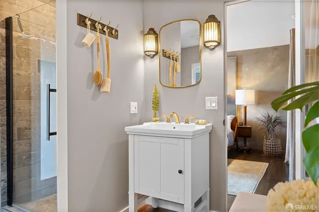 a bathroom with a sink and mirror