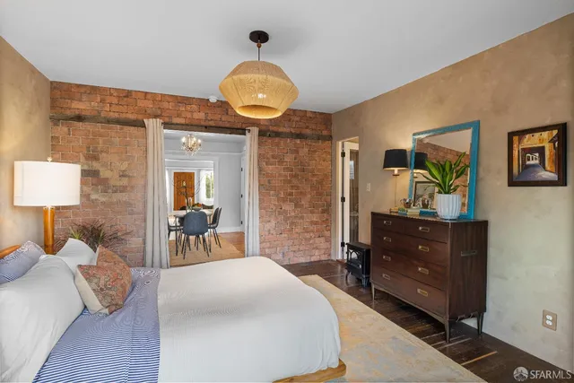 a bed room with a bed and a chandelier