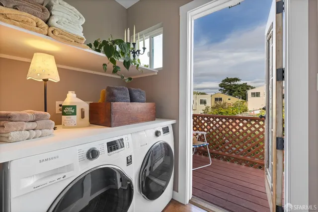 a utility room with dryer and washer