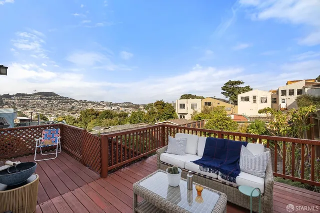 a view of a balcony with wooden floor
