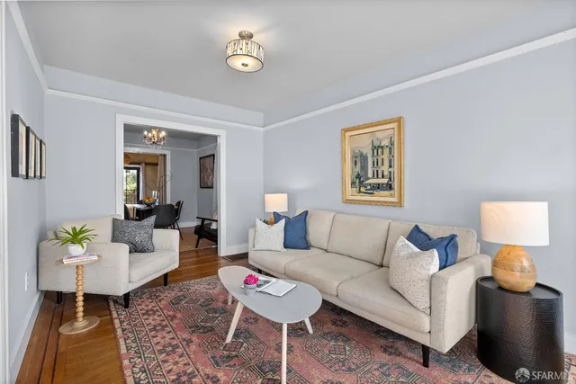 a living room with furniture and a table