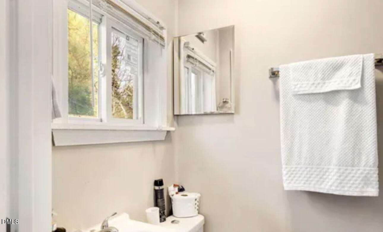 810 Milton Road Durham, NC 27712 - Photo 11 of 21 a bathroom with a sink and a window
