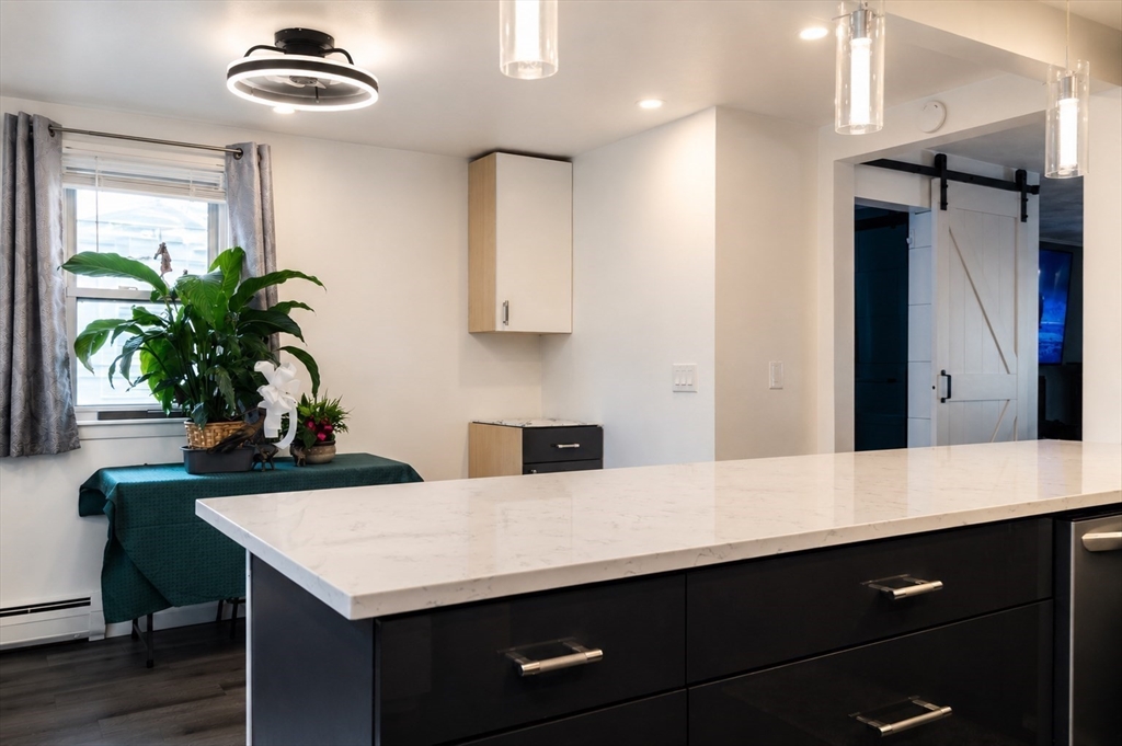 18 Ralston Road Boston, MA 02136 - Photo 4 of 26 a kitchen with a table and chairs in it
