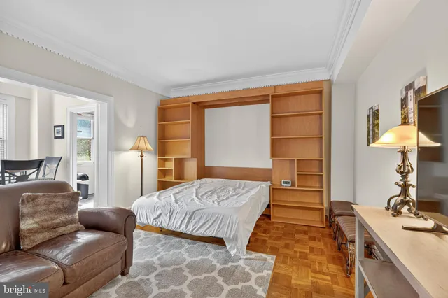 a bedroom with furniture and a window