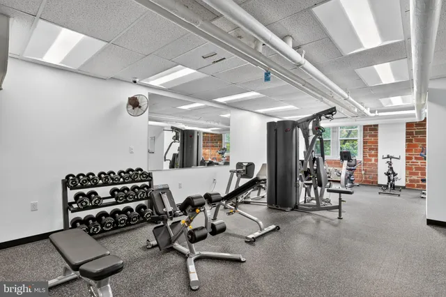 a room with gym equipment and lots of gym equipment