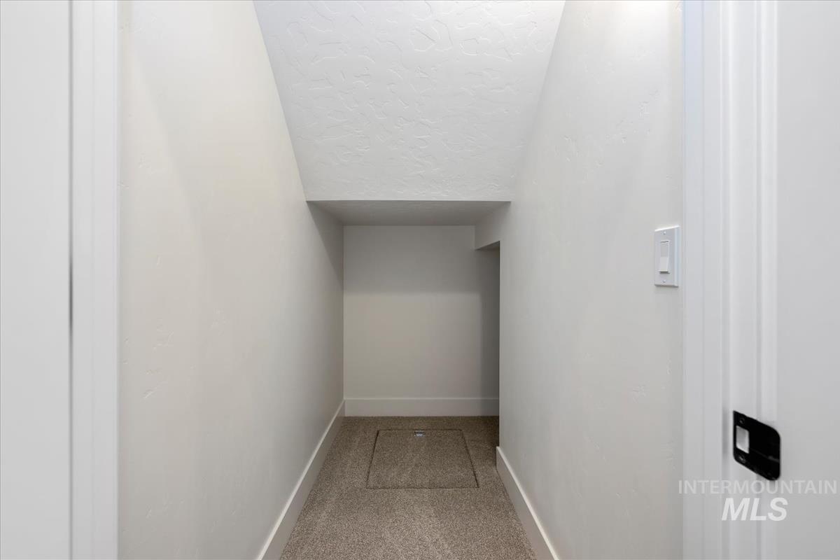 768 South Calhoun Lane Star, ID 83669 - Photo 32 of 36 Recessed alcove storage area with light beige carpet flooring and white baseboards