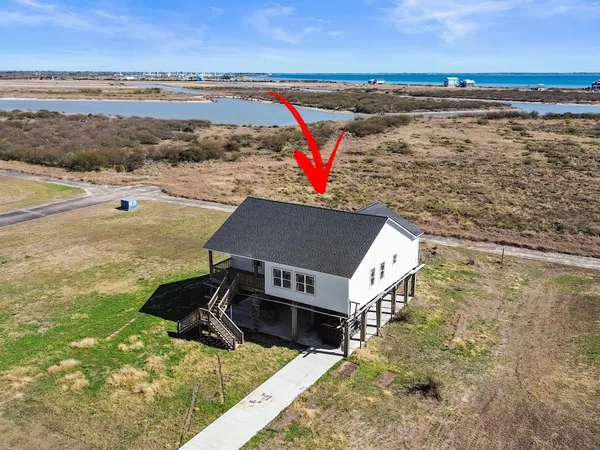 a view of houses with ocean view