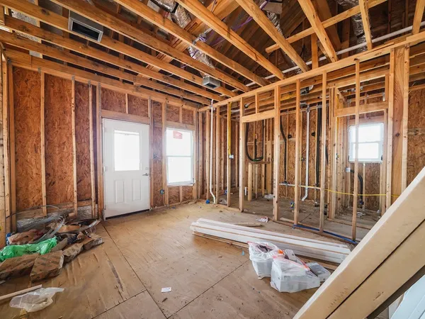 a view of an empty room with stairs