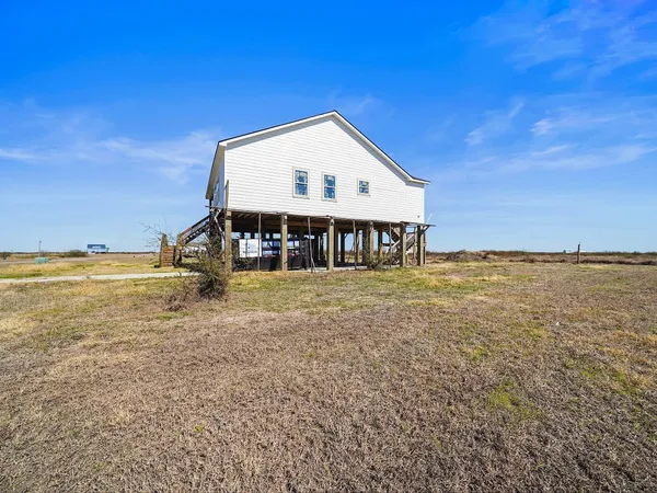 a view of a house with a big yard