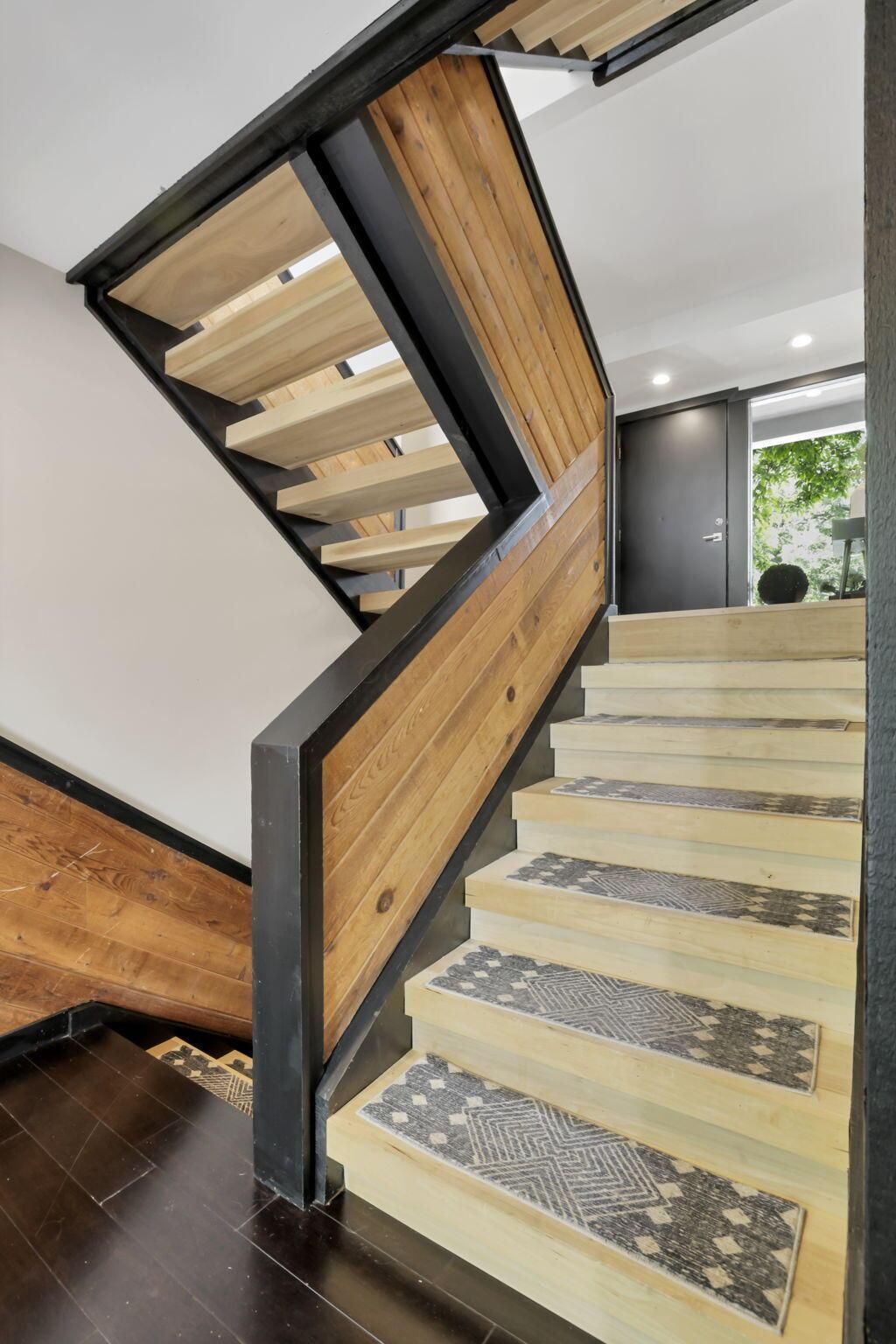 4390 Dublin Road Columbus, OH 43221 - Photo 41 of 83 Redesigned custom interior wood wrapped floating stairs.