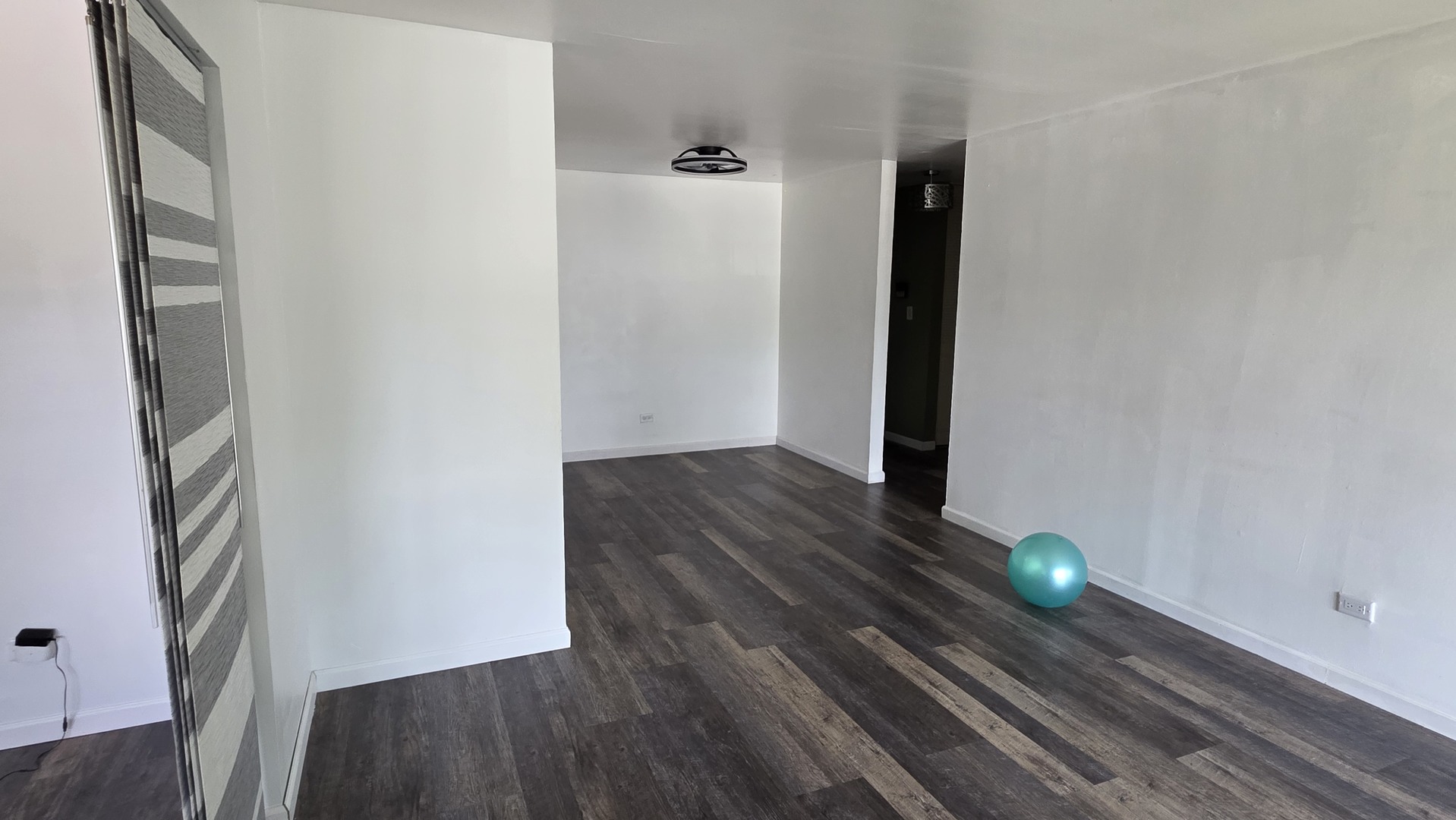9446 Dee Road, Unit 2E Des Plaines, IL 60016 - Photo 11 of 37 a view of a livingroom with wooden floor