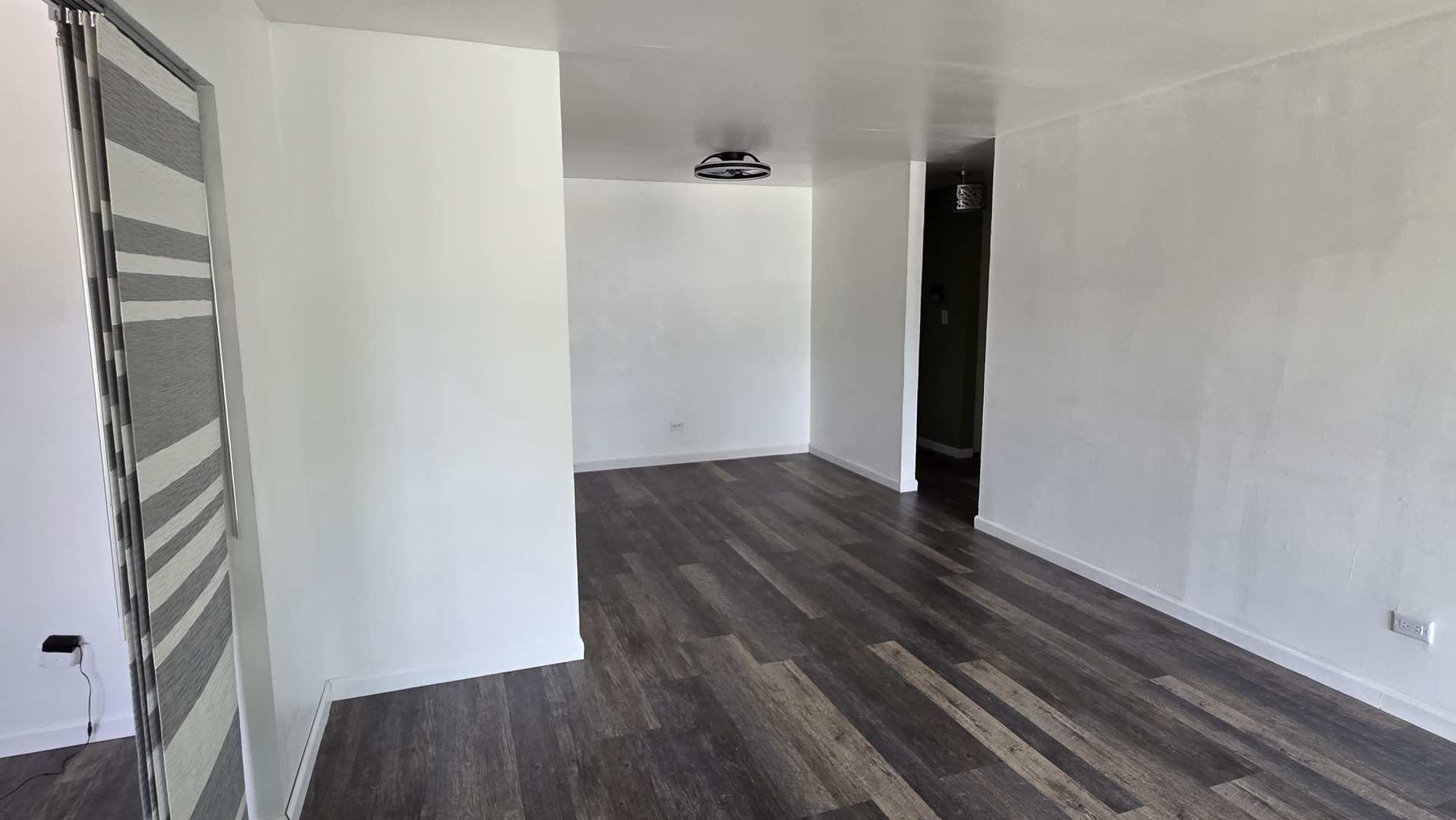 9446 Dee Road, Unit 2E Des Plaines, IL 60016 - Photo 12 of 37 a view of a hallway with wooden floor