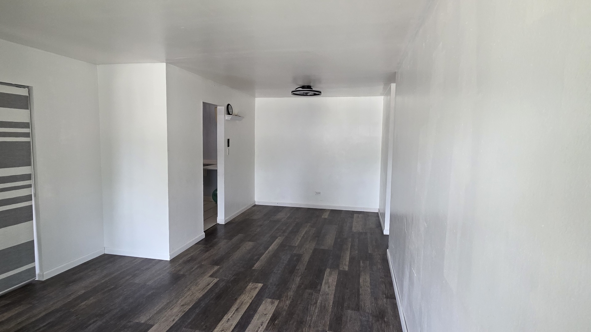 9446 Dee Road, Unit 2E Des Plaines, IL 60016 - Photo 13 of 37 a view of a hallway with wooden floor