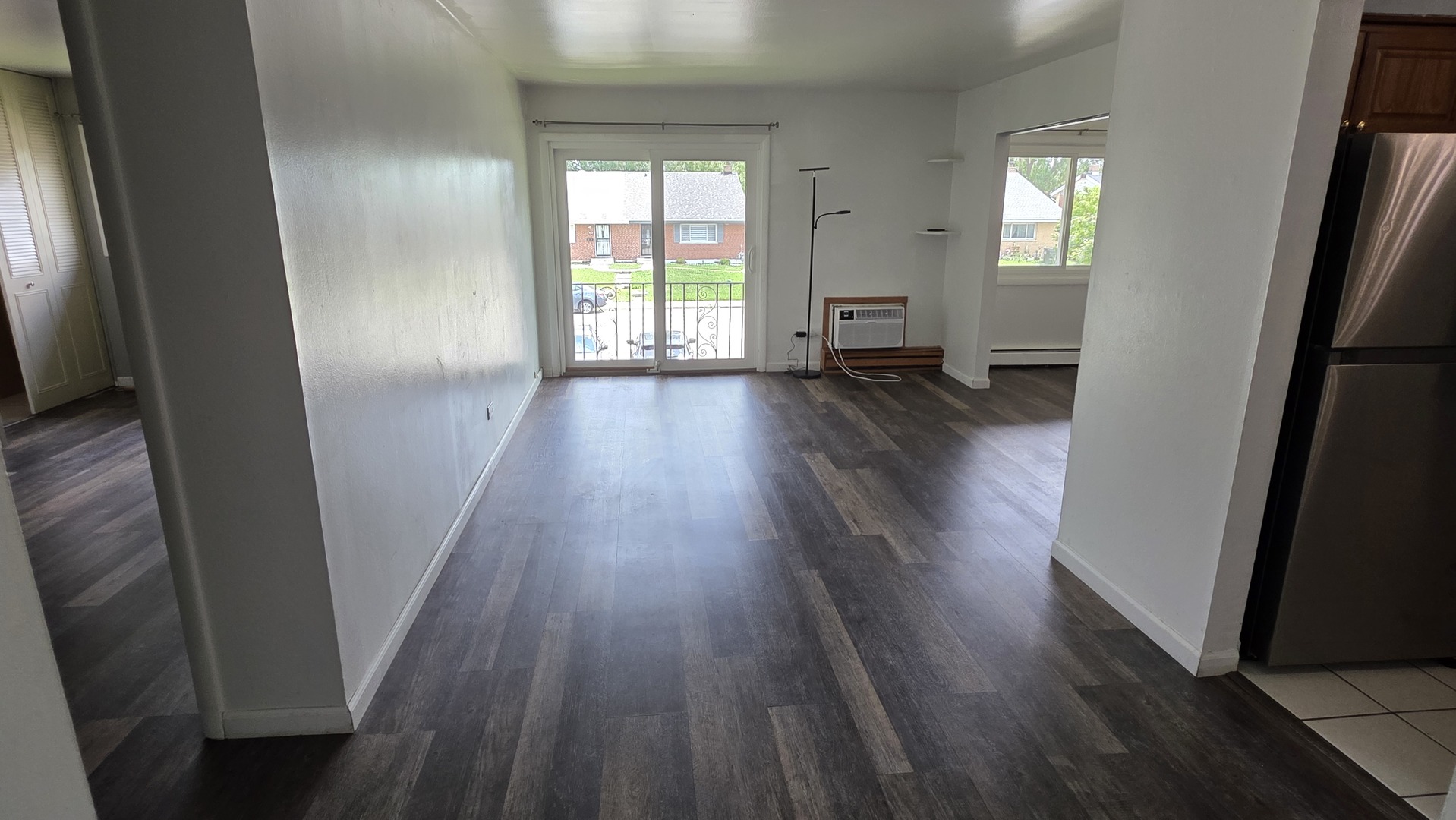 9446 Dee Road, Unit 2E Des Plaines, IL 60016 - Photo 16 of 37 wooden floor in an empty room with a window