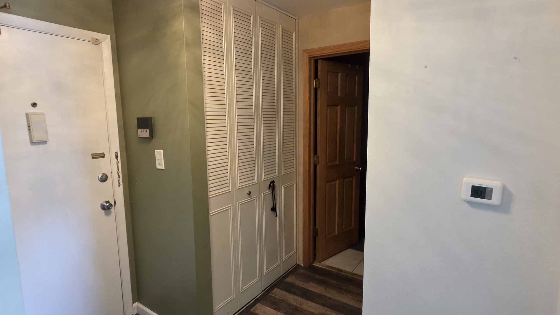 9446 Dee Road, Unit 2E Des Plaines, IL 60016 - Photo 23 of 37 a view of a bathroom from a hallway