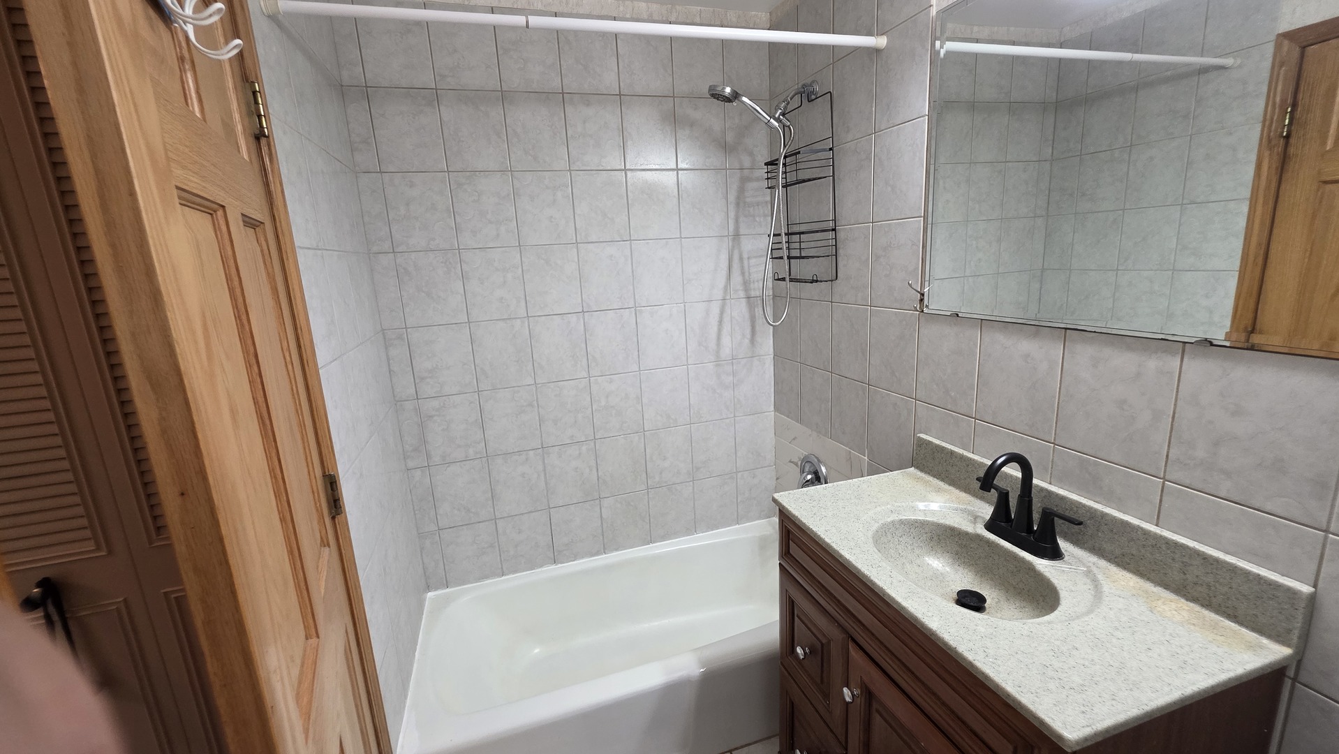 9446 Dee Road, Unit 2E Des Plaines, IL 60016 - Photo 24 of 37 a bathroom with a sink a toilet and shower