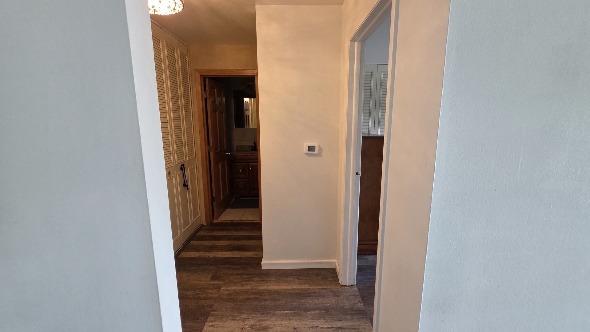 9446 Dee Road, Unit 2E Des Plaines, IL 60016 - Photo 27 of 37 a view of a hallway with wooden floor