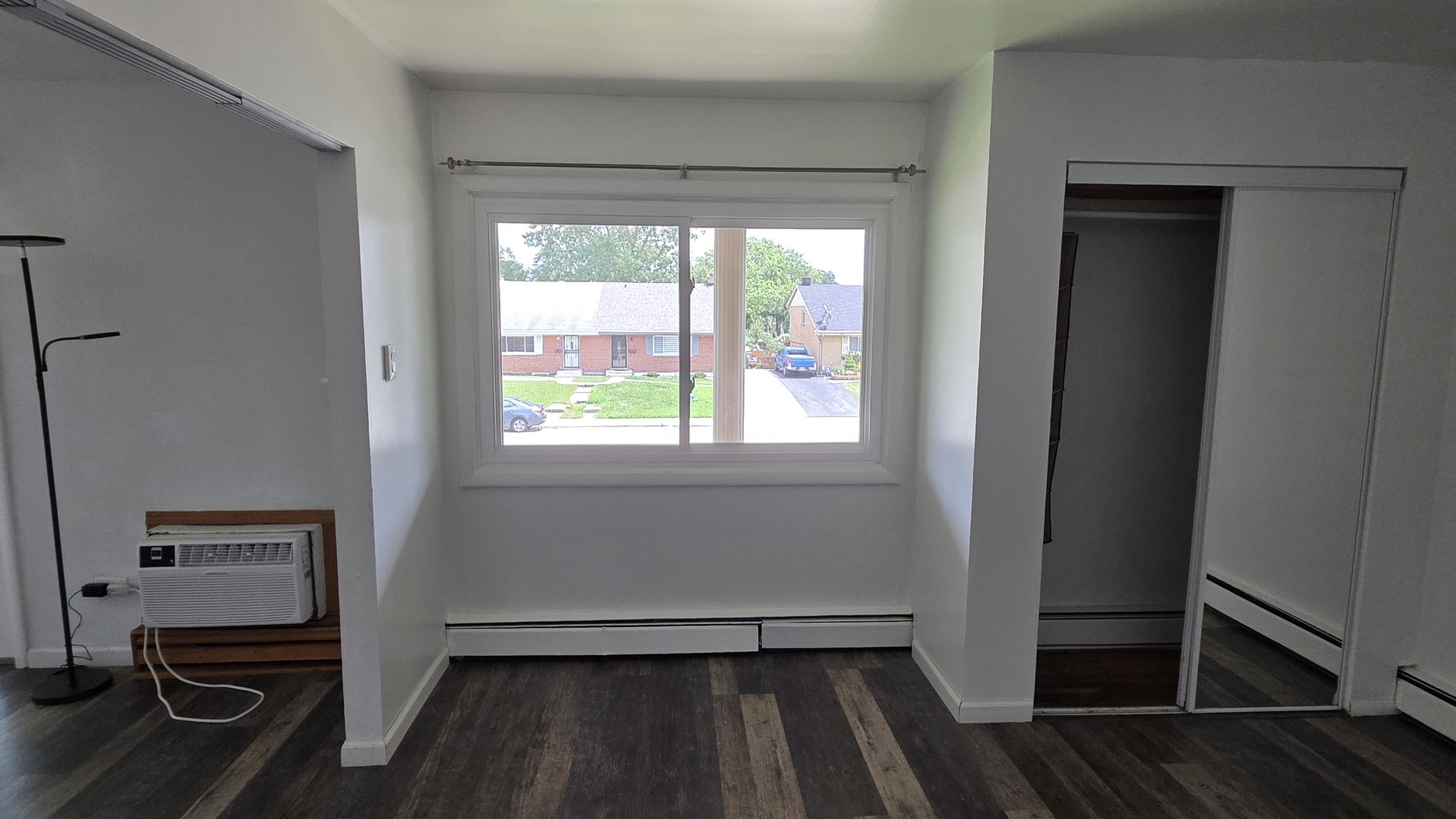 9446 Dee Road, Unit 2E Des Plaines, IL 60016 - Photo 7 of 37 a view of empty room with wooden floor and fan