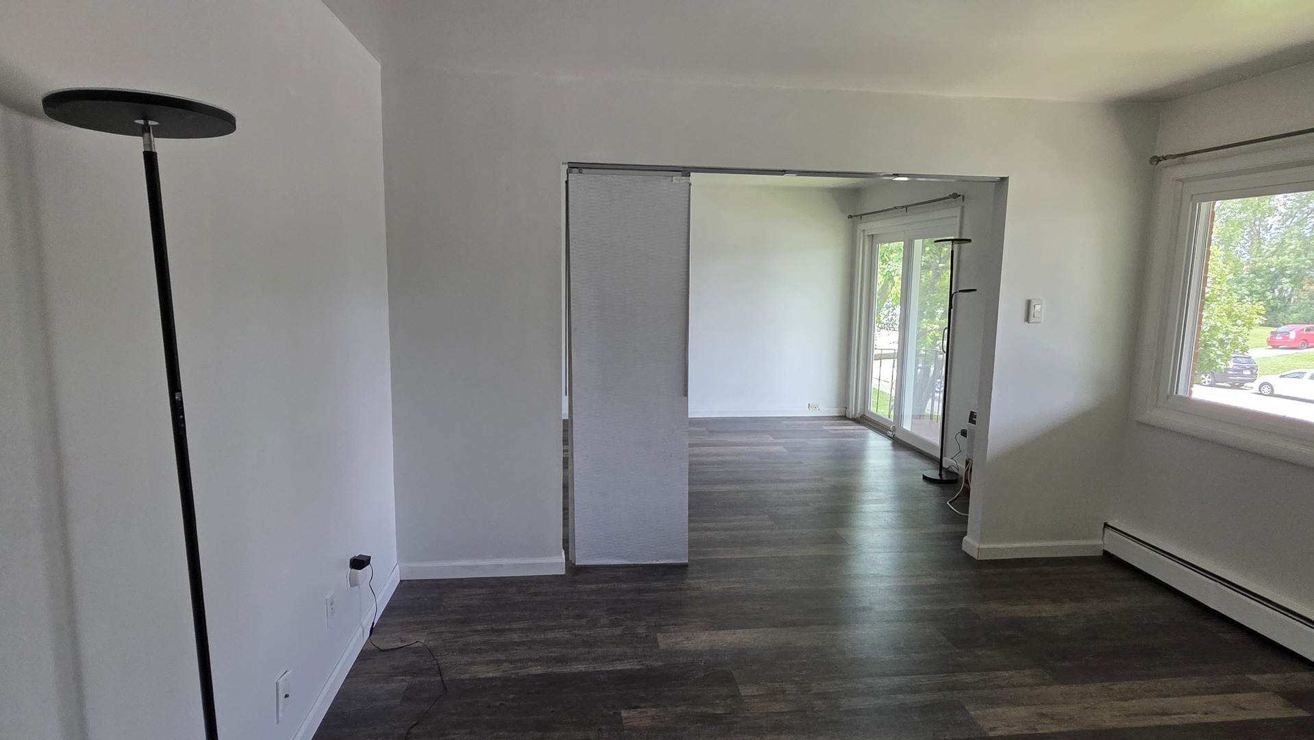 9446 Dee Road, Unit 2E Des Plaines, IL 60016 - Photo 9 of 37 a view of hallway with window and wooden floor