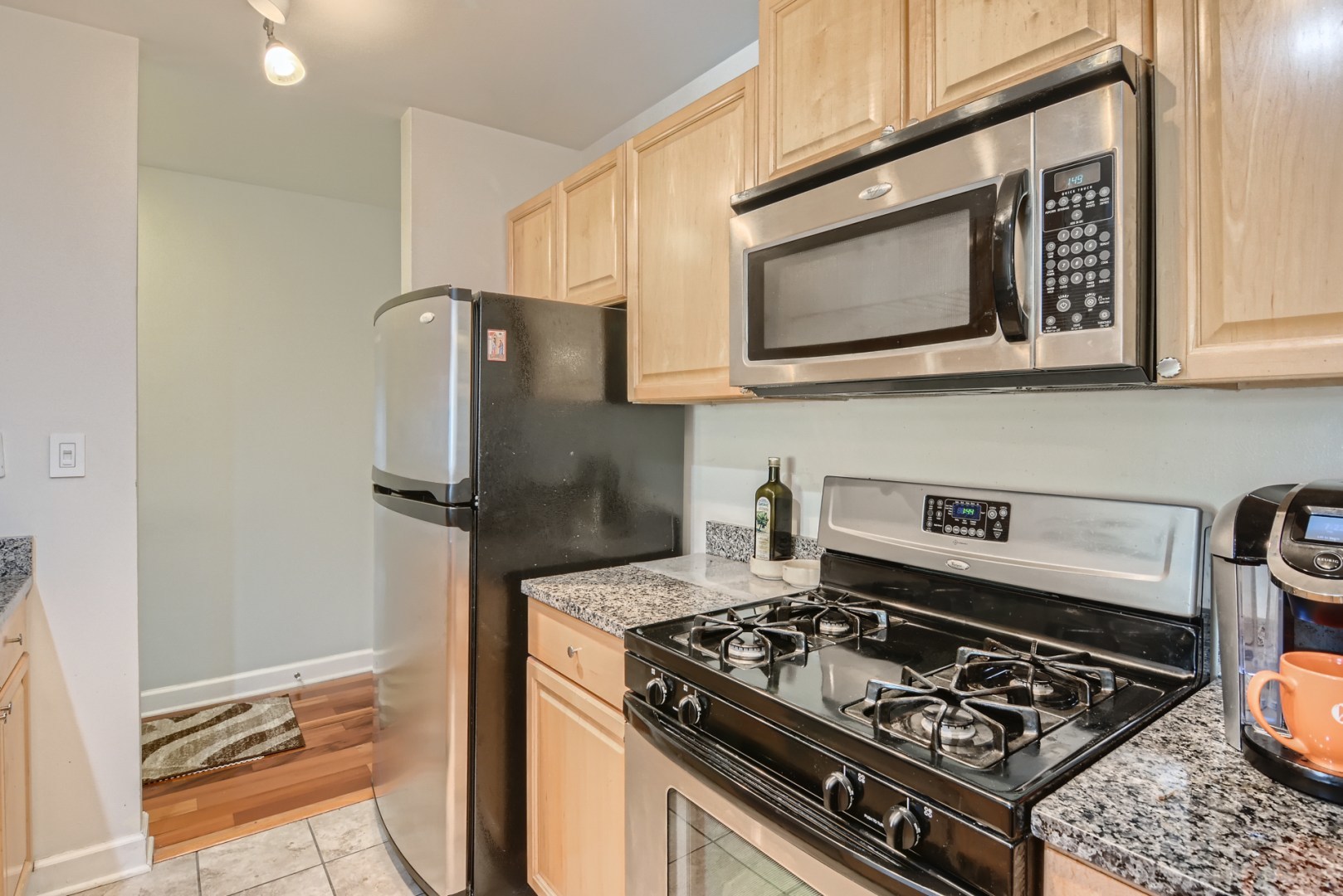 1931 Prairie Square, Unit 331 Schaumburg, IL 60173 - Photo 4 of 19 a kitchen with a stove and a microwave