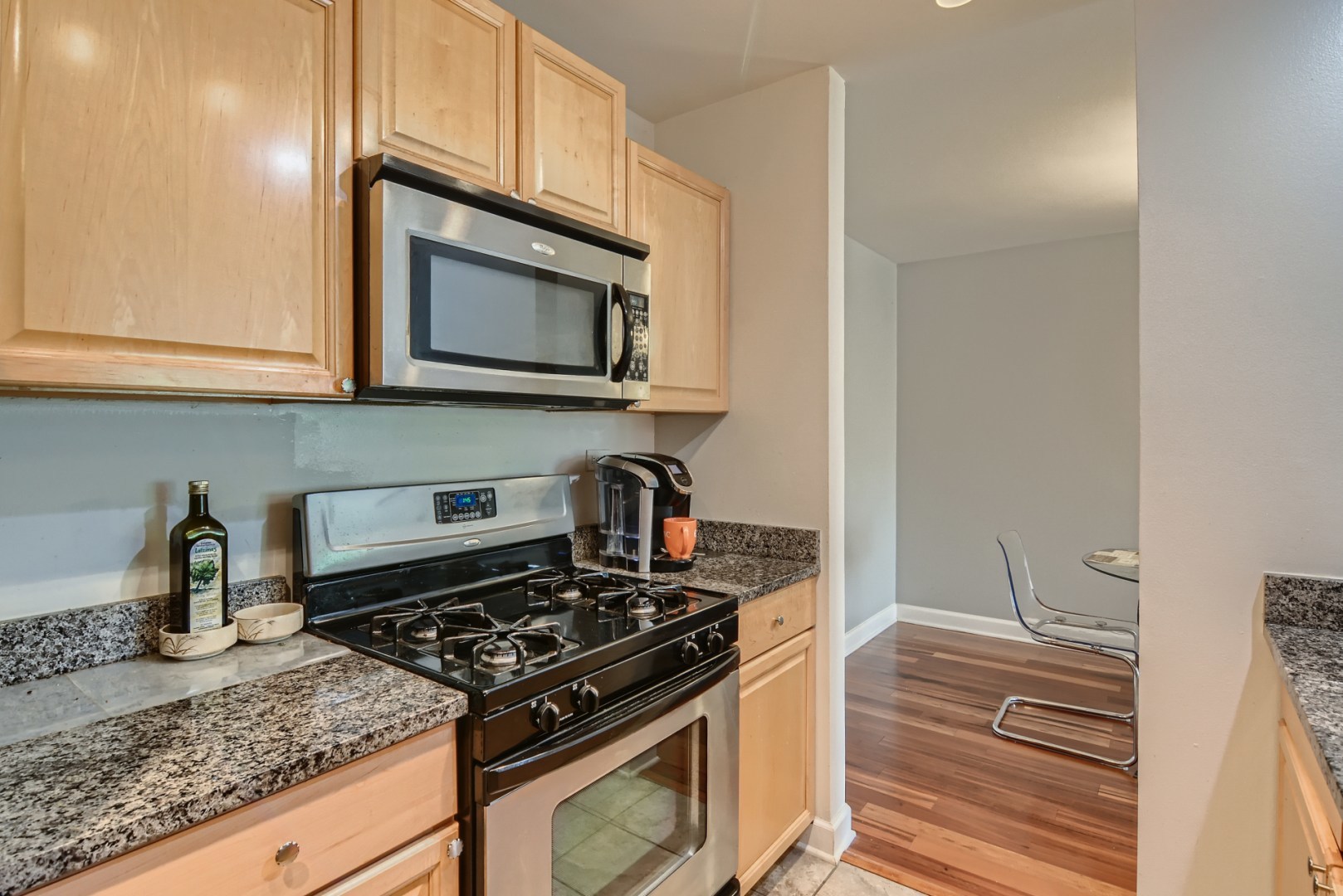 1931 Prairie Square, Unit 331 Schaumburg, IL 60173 - Photo 6 of 19 a kitchen with granite countertop a stove and a sink