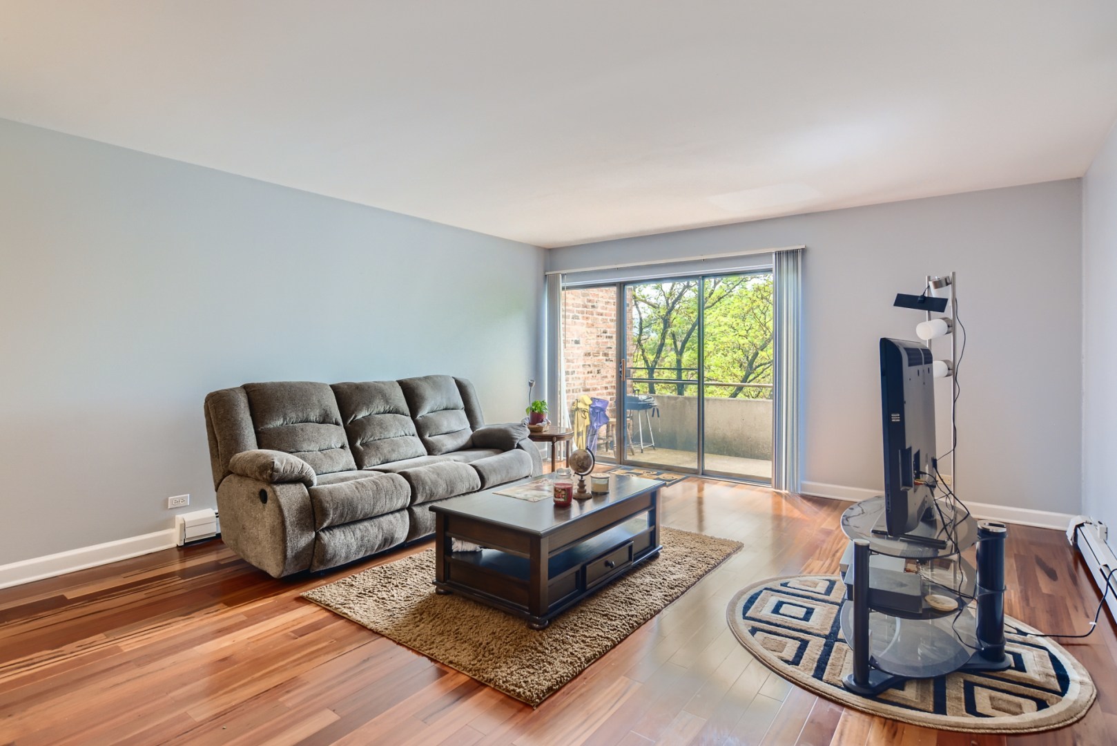 1931 Prairie Square, Unit 331 Schaumburg, IL 60173 - Photo 7 of 19 a living room with furniture and a large window