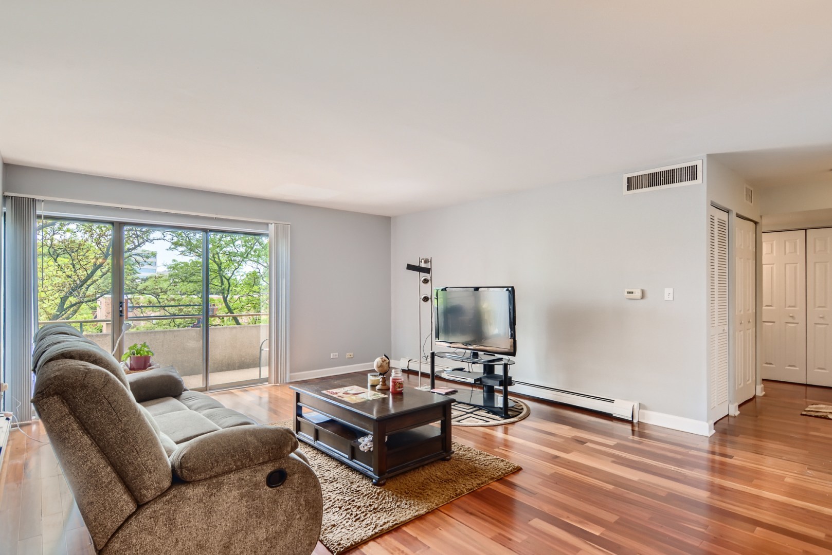 1931 Prairie Square, Unit 331 Schaumburg, IL 60173 - Photo 8 of 19 a living room with furniture and a large window