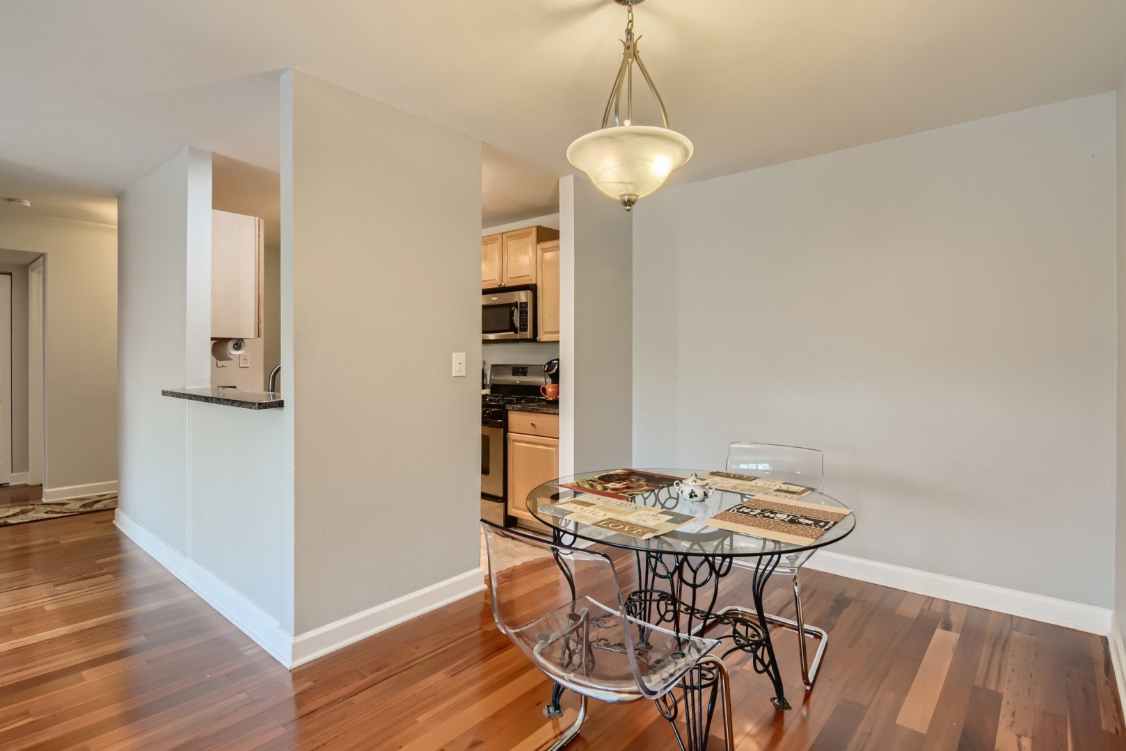 1931 Prairie Square, Unit 331 Schaumburg, IL 60173 - Photo 10 of 19 a view of a dining room with a table and chairs