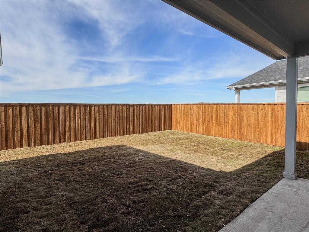 350 Lucy Road Greenville, TX 75402 - Photo 15 of 16 a view of backyard with wooden fence