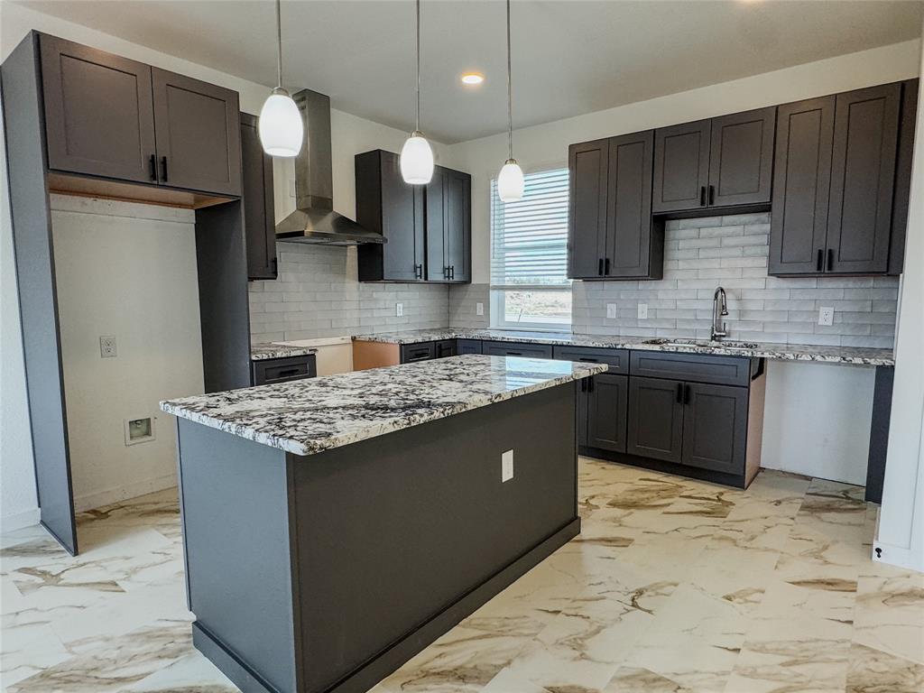 350 Lucy Road Greenville, TX 75402 - Photo 2 of 16 a kitchen with granite countertop a sink stainless steel appliances and cabinets