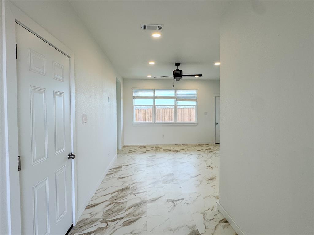 350 Lucy Road Greenville, TX 75402 - Photo 5 of 16 a view of an empty room and window