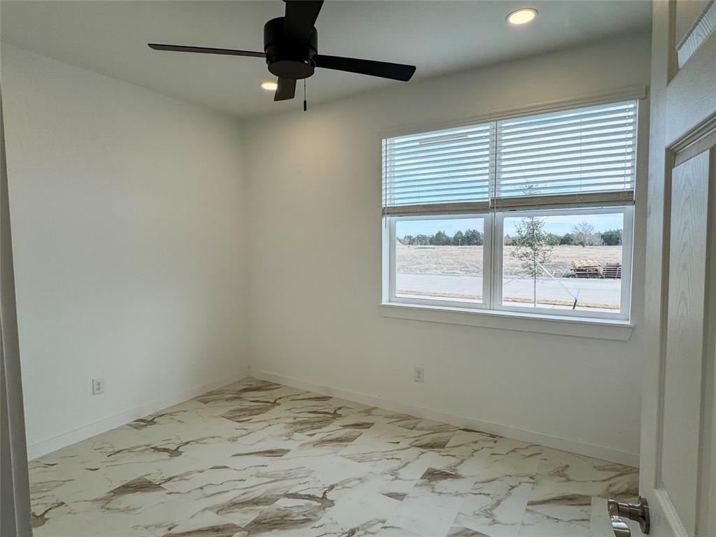 350 Lucy Road Greenville, TX 75402 - Photo 6 of 16 a view of a room with a window and ceiling fan