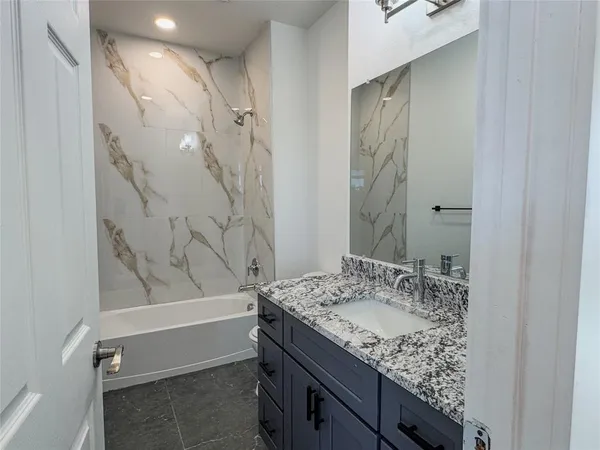 a bathroom with a sink and a shower