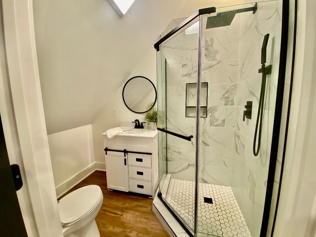 265 Rock Quarry Way Counce, TN 38326 - Photo 13 of 17 a bathroom with a sink toilet and shower