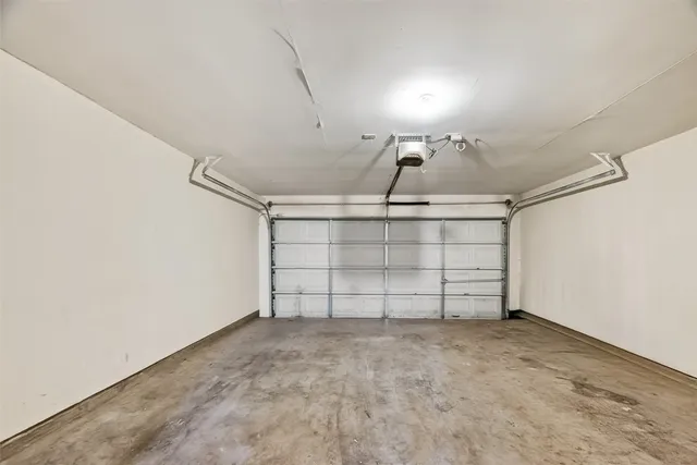 a view of backyard with small cabin and wooden fence