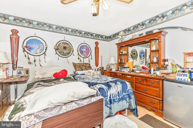 a bed room with a bed and a large window