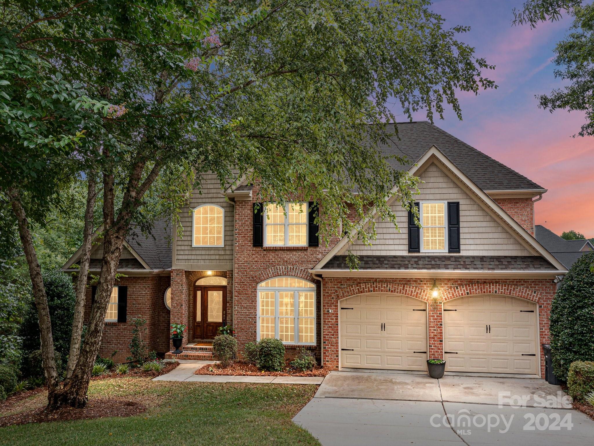 146 Canterbury Crossing Fort Mill, SC 29708 - Photo 1 of 48 a front view of a house with a yard