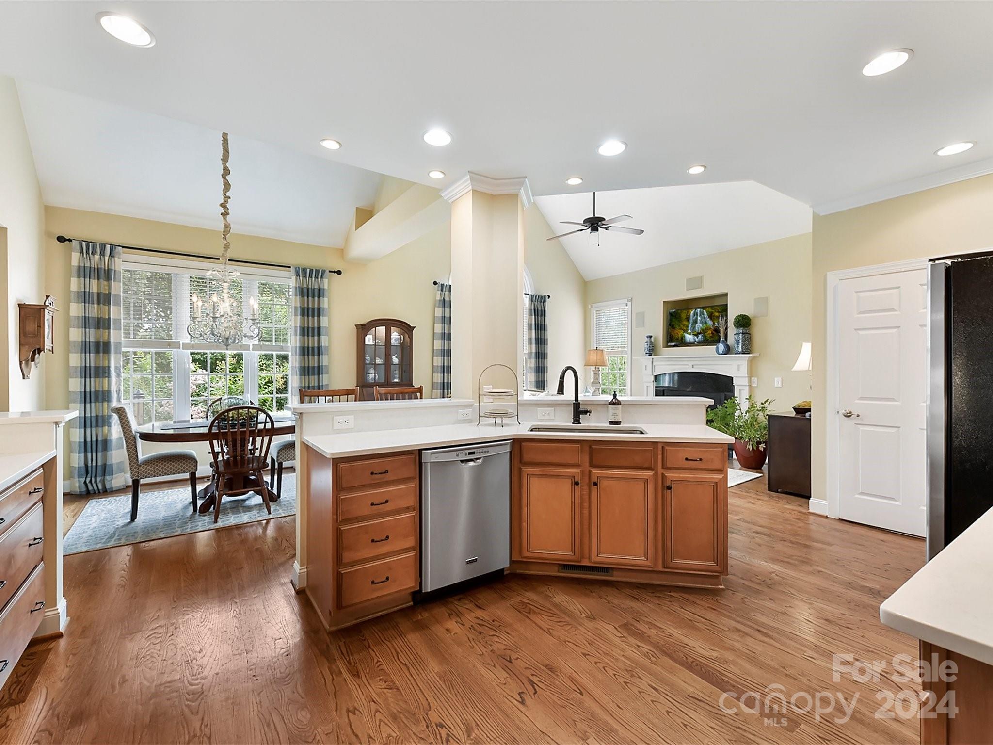 146 Canterbury Crossing Fort Mill, SC 29708 - Photo 12 of 48 a large kitchen with cabinets chairs and wooden floor